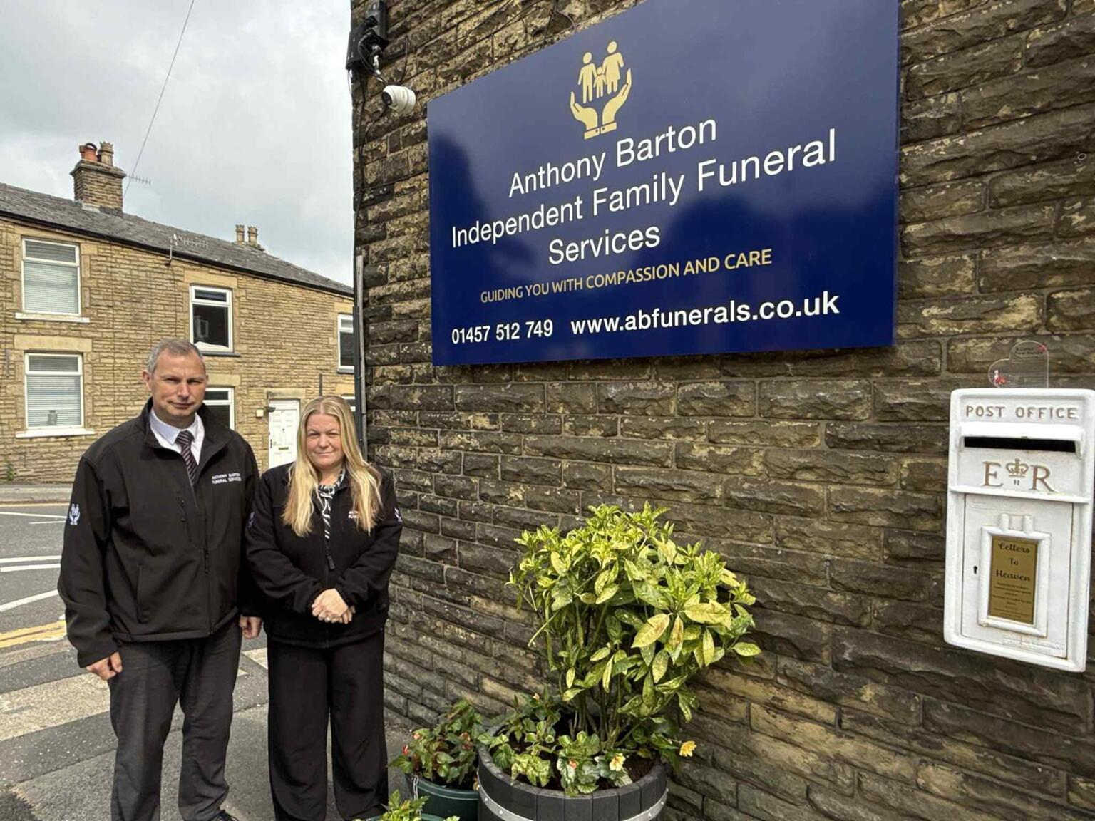 Anthony Barton Funeral Services team members standing outside the office.