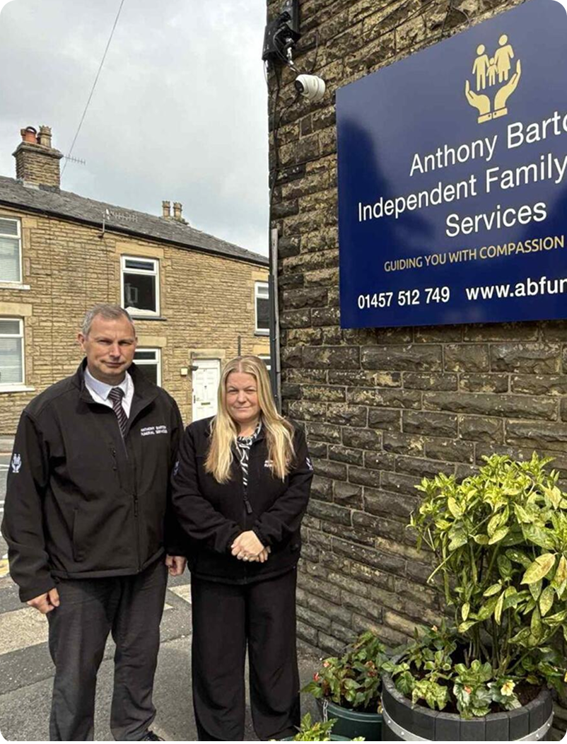 Anthony Barton Funeral Services team members standing outside the office.