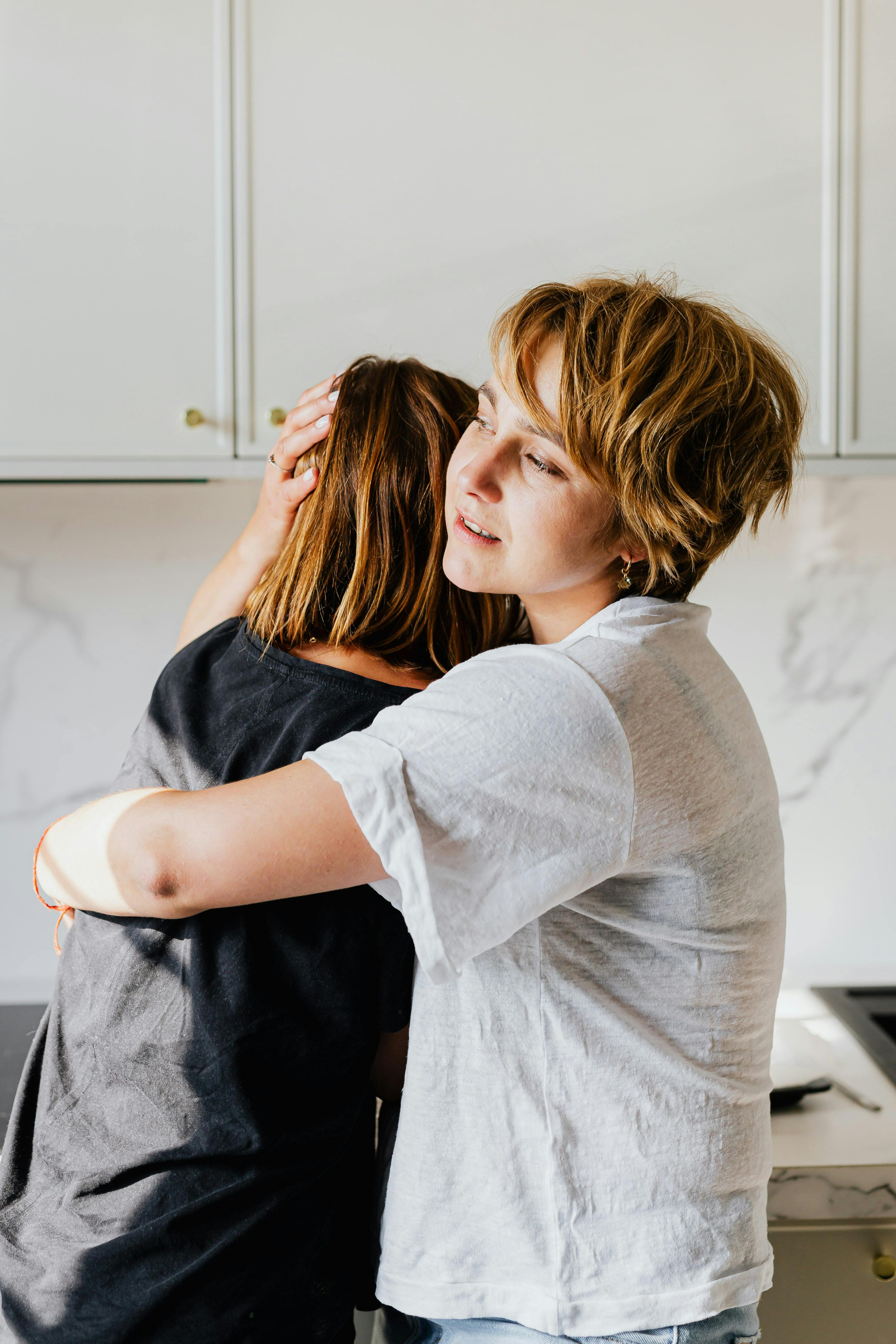 A comforting embrace between family members.