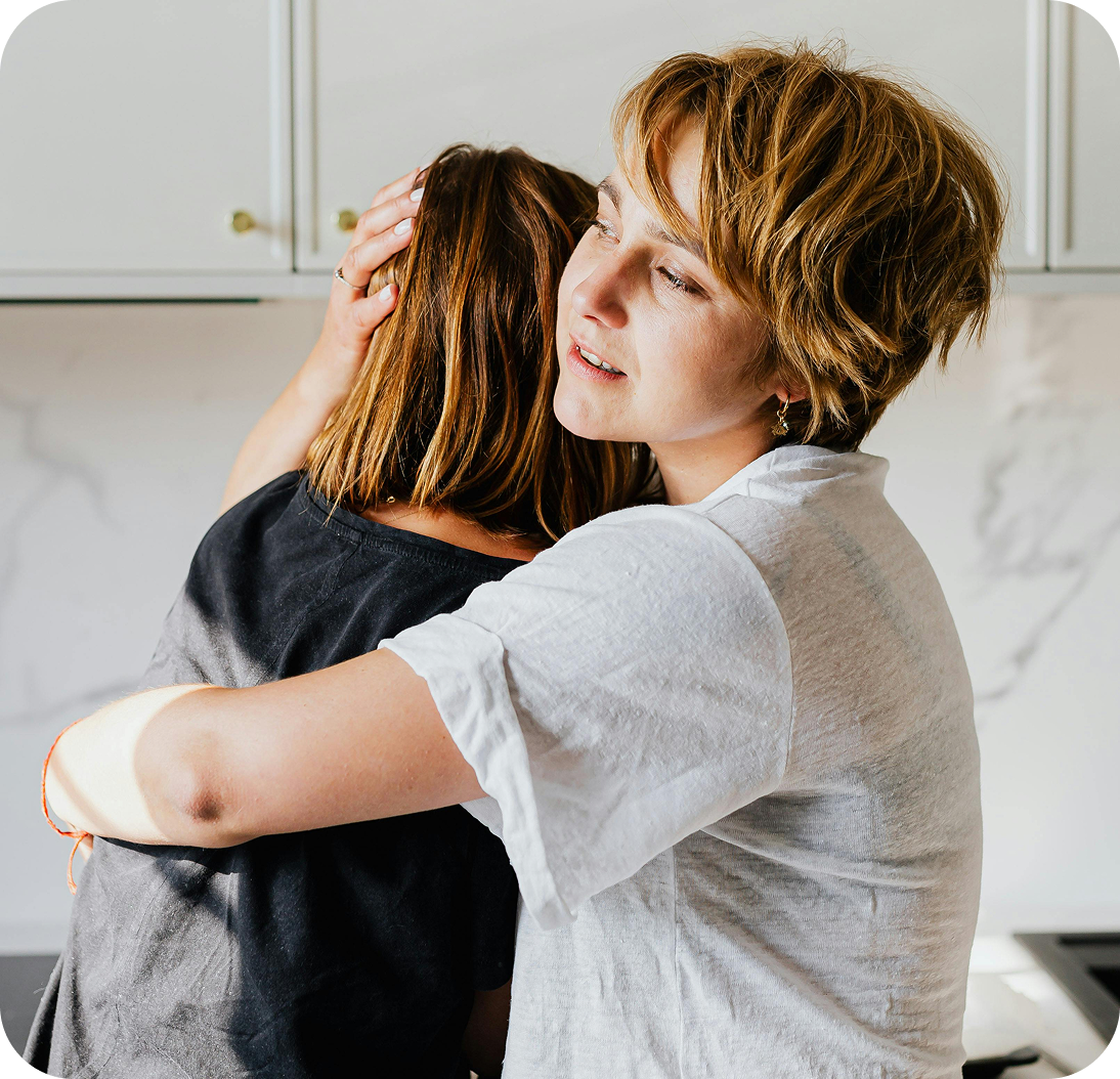 A comforting embrace between family members.